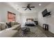 Bright and airy living space featuring a comfortable couch, decorative rug, and a modern entertainment setup at 125 Ketton Xing, Johns Creek, GA 30097