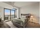 Bedroom features gray color palette, plush carpet, and balcony at 270 17Th Nw St # 3604, Atlanta, GA 30363