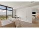 Bright bedroom featuring a large window with city views and entry to the home's living room at 270 17Th Nw St # 3604, Atlanta, GA 30363