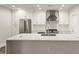 Spacious kitchen with white cabinets, stainless steel appliances, and a large central island at 270 17Th Nw St # 3604, Atlanta, GA 30363