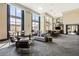 Bright and airy lounge area with floor-to-ceiling windows and chic furniture at 270 17Th Nw St # 3604, Atlanta, GA 30363