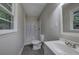 Bathroom featuring a tub/shower and a vanity with a round mirror at 3647 Miller St, Lithia Springs, GA 30122