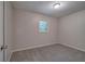 Simple bedroom featuring carpet, neutral paint and a sunny window at 3647 Miller St, Lithia Springs, GA 30122