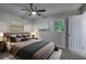 Cozy bedroom features neutral tones, soft carpet, and a ceiling fan for added comfort at 3647 Miller St, Lithia Springs, GA 30122