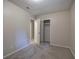 Neutral bedroom with carpeted floors and convenient access to a closet and other rooms at 3647 Miller St, Lithia Springs, GA 30122