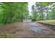 A two car garage is situated at the end of a long driveway at 3647 Miller St, Lithia Springs, GA 30122