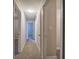 Hallway with neutral paint and lighting leading to other rooms at 3647 Miller St, Lithia Springs, GA 30122