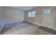 A versatile empty room, carpeted with a full view of the front door at 3647 Miller St, Lithia Springs, GA 30122
