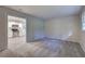 Open living space with carpet and view into the kitchen at 3647 Miller St, Lithia Springs, GA 30122