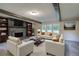 Inviting living room with a stone fireplace, built-in bookshelves, and ample seating at 3647 Miller St, Lithia Springs, GA 30122