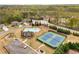 Aerial view of the community amenities including a pool, clubhouse, tennis courts, and playground at 403 Aristides Way, Canton, GA 30115