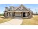 A beautiful clubhouse features stone accents, covered seating, and manicured landscaping at 403 Aristides Way, Canton, GA 30115
