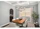Dining room with coffered ceilings, modern chandelier, and large window at 403 Aristides Way, Canton, GA 30115