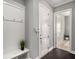 Hallway features hooks, and a bench with access to other rooms at 403 Aristides Way, Canton, GA 30115