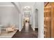 Bright hallway with hardwood floors, archways, and elegant lighting at 403 Aristides Way, Canton, GA 30115