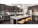 Gourmet kitchen with granite counters, stainless appliances, and a center island at 403 Aristides Way, Canton, GA 30115