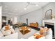 Spacious living room with a fireplace, comfortable seating, and an open layout, ideal for gatherings at 403 Aristides Way, Canton, GA 30115