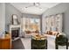 Bright living room with a fireplace, plush sofas, and large windows, perfect for relaxation and entertaining at 403 Aristides Way, Canton, GA 30115