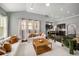 Inviting living room with large windows, neutral décor, and a view into the modern kitchen, perfect for entertaining at 403 Aristides Way, Canton, GA 30115