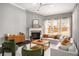 Cozy living room with fireplace, lots of natural light and comfortable seating at 403 Aristides Way, Canton, GA 30115