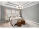 Comfortable bedroom features a stylish ceiling, neutral colors, and a cozy bed at 403 Aristides Way, Canton, GA 30115