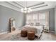 Serene main bedroom with a tray ceiling, large window, and designer touches at 403 Aristides Way, Canton, GA 30115