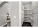 Walk-in pantry with ample shelving space for organized storage and easy access to kitchen essentials at 403 Aristides Way, Canton, GA 30115