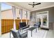 Relaxing covered patio furnished with comfortable seating, perfect for outdoor entertaining at 403 Aristides Way, Canton, GA 30115