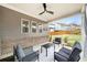 Cozy patio with stylish furniture, ceiling fan, and views of the fenced backyard at 403 Aristides Way, Canton, GA 30115