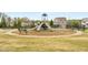 Community playground with slides, benches, and a surrounding fence for safety at 403 Aristides Way, Canton, GA 30115