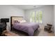 Cozy bedroom with a comfortable bed, plantation shutters, and neutral decor at 907 Edgewood Ave, Atlanta, GA 30307