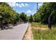 Scenic community trail with lush greenery and mature trees, perfect for walking and enjoying nature at 907 Edgewood Ave, Atlanta, GA 30307