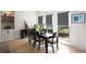 Bright dining area with large windows and an open view to the kitchen at 907 Edgewood Ave, Atlanta, GA 30307