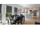 Charming dining area with backyard views and an open floor plan to the kitchen at 907 Edgewood Ave, Atlanta, GA 30307