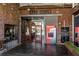 Krog Street Market entrance with brick facade, ATM, and glass doors in a dynamic urban setting at 907 Edgewood Ave, Atlanta, GA 30307