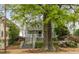 Beautiful two-story home with a well-manicured lawn and mature trees at 907 Edgewood Ave, Atlanta, GA 30307