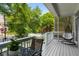Cozy front porch with a hanging chair and table overlooking the neighborhood at 907 Edgewood Ave, Atlanta, GA 30307