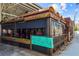 Charming outdoor seating area with weathered metal awning, rustic planters, and inviting ambiance at 907 Edgewood Ave, Atlanta, GA 30307