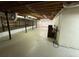 Large, unfinished basement with visible ceiling joists and concrete flooring at 9214 Brave Ct, Jonesboro, GA 30236