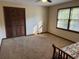 Bright bedroom with a large closet, natural light, and a ceiling fan at 9214 Brave Ct, Jonesboro, GA 30236