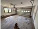 A spacious two-car garage featuring an automatic door and natural light from a side window at 9214 Brave Ct, Jonesboro, GA 30236