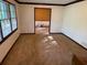 Open-concept living room with hardwood floors and large windows for natural light at 9214 Brave Ct, Jonesboro, GA 30236