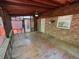 An enclosed screened porch with a brick wall, ceiling fan, and access to the outdoor area at 9214 Brave Ct, Jonesboro, GA 30236