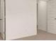 Bright bedroom features neutral carpet and white walls, offering a blank canvas at 1139 Blue Juniper Cir, Loganville, GA 30052