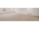Spacious bedroom featuring plush carpeting, natural light, and neutral walls at 1139 Blue Juniper Cir, Loganville, GA 30052