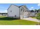 Spacious home with a combination brick and siding exterior, and a well-manicured lawn at 1139 Blue Juniper Cir, Loganville, GA 30052