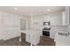 Bright kitchen features stainless appliances, white countertops, and an island with elegant turned legs at 1139 Blue Juniper Cir, Loganville, GA 30052