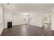 Spacious living area showcasing an open floor plan, fireplace, and staircase at 1139 Blue Juniper Cir, Loganville, GA 30052
