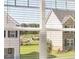 Exterior home view seen through window blinds and glass at 1139 Blue Juniper Cir, Loganville, GA 30052