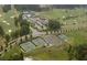 Overhead shot of the community showcasing tennis courts, golf course, and green spaces at 135 Ardsley Run, Canton, GA 30115